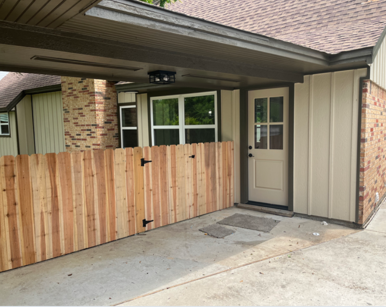 Exterior remodeling project with new siding, door, windows, and wood gate